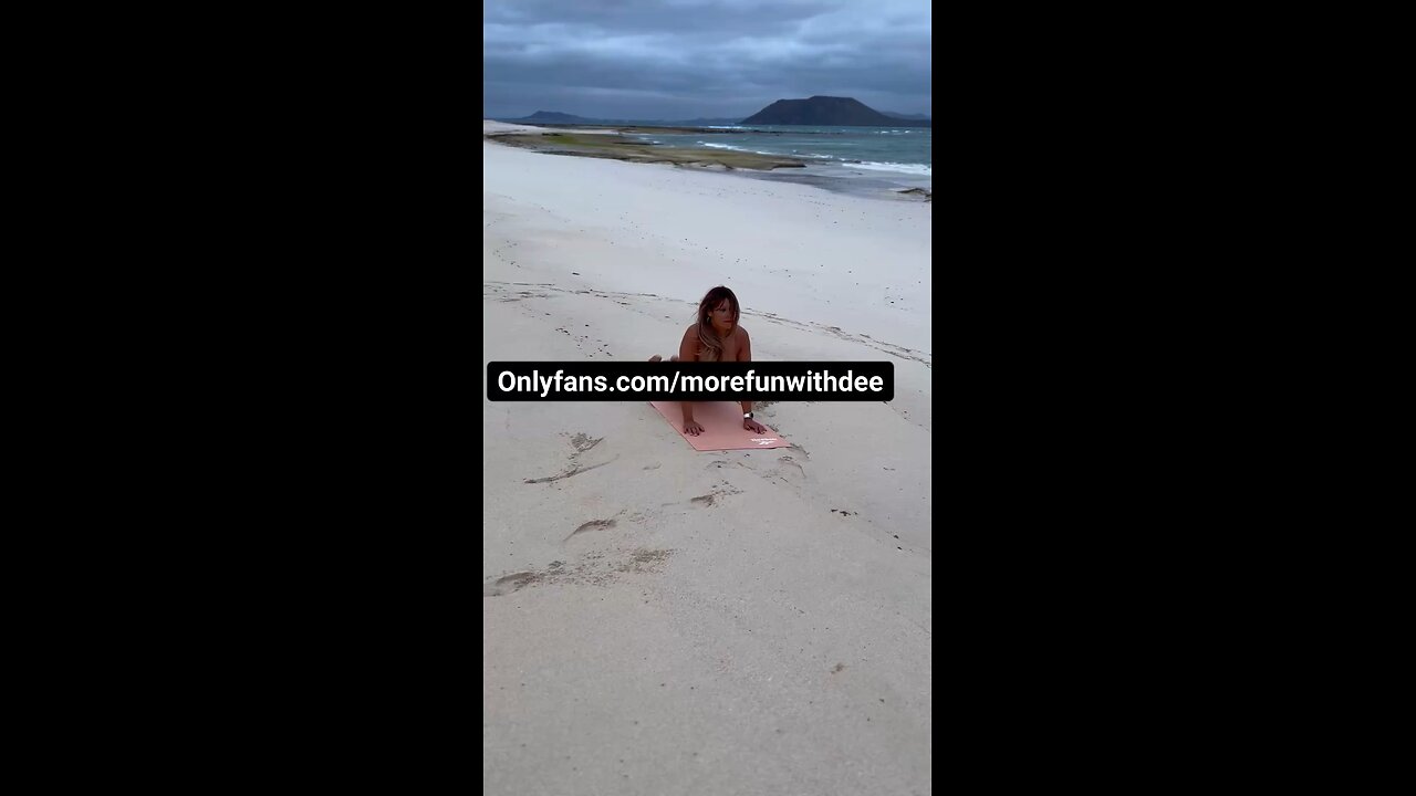 Naked Yoga On The Beach With People Walking Around