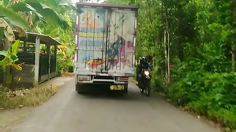 The Canter Truck Drives on Village Road Towards the Loading Location at the Allisha Food Packaging Sate Ambal Factory