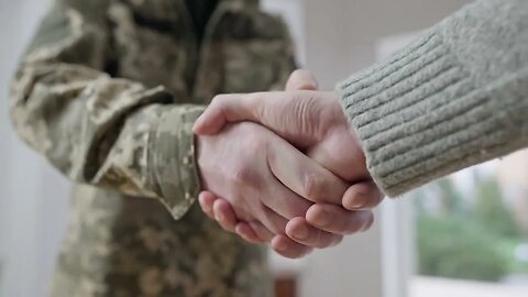 close up handshake of middle aged soldier in camouflage and young caucasian man unr SBV 346468333 HD