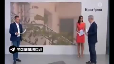 Greek TV presenter does a 'Pfizer' live on air...