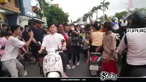 A Girl Kissed Speed Randomly on Cheek In Cambodia During he was going on a Moped Bike