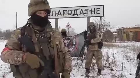 Wagner PMC stand in front of the towns sign to say the town is taken