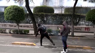 Demonstrators hurl firecrackers to protest Mexico's missing students