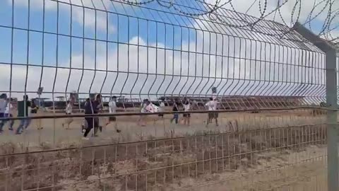 Families of Israeli captives cross the separation fence on the Gaza border