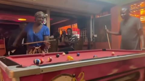 Woman shows her skills in billiards