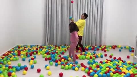 Kids are playing with colorful balls