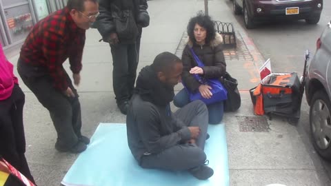 Luodong Massages Black Man With Curious Onlookers