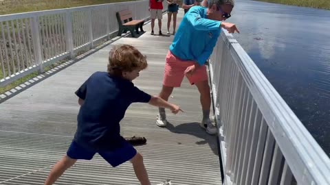 Battle at Loxahatchee! Father & son struggle to land massive bowfin without gator snatching it!