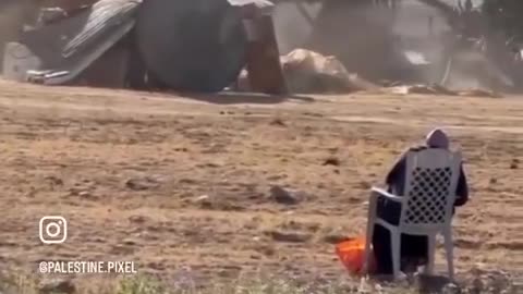 A senior Palestinian lady looks on helplessly as her house in the occupied Naqab is demolished