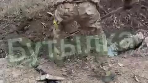 Ukronazis burying one of their own alive