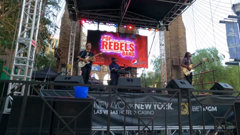 A band playing disco music in front of theNew York, New York Hotel on the Las Vegas strip.