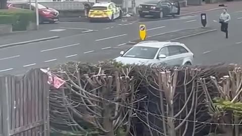 Ralston, Scotland UK: A Police Officer is seen being chased by a man wielding a chainsaw..🤷‍♂️