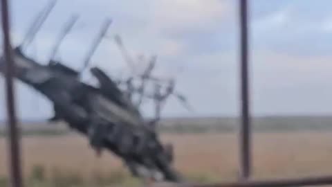 A destroyed Russian T-90M tank with the barrel on its blown of turret stuck in the ground