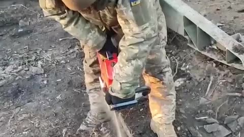 Cutting into the Frozen Ground with a Chain Saw