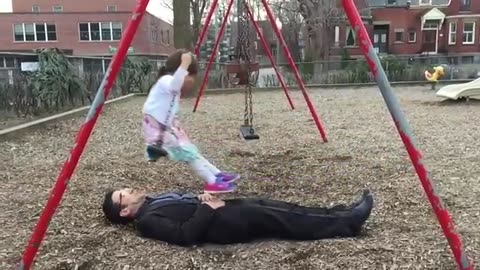 Awesome dad perfects swing stunt at the park