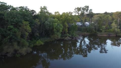 Neighborhood Pond at Sunset from a Drone