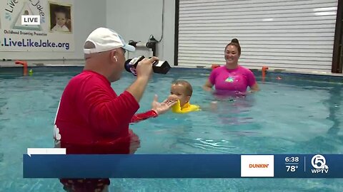 Training babies swimming safety skills in Palm Beach Gardens