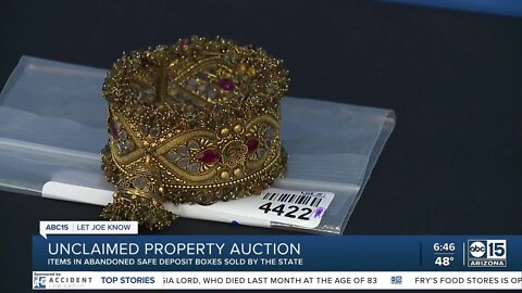 State auctioning unclaimed property including coins, silver, and sports cards