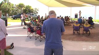 Several people gathered at Waterfront Park for prayer