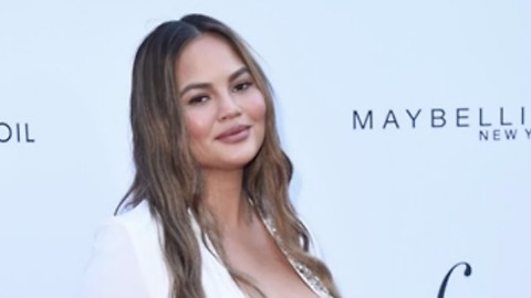 Chrissy Teigen’s Skin-Tight Dress Shows Off Massive Baby Bump