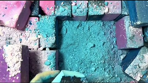 Crushing blue dusty chalk for satisfying video