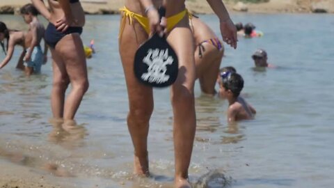 Woman Playing Tennis at the Beach in Slow Motion