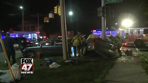 Crash closed down lanes of busy Lansing intersection Monday