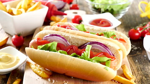 Fastfood assortment Hamburgers and hot dogs placed on rusty wood table