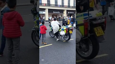 People queue up to sit on a police bike #metpolice