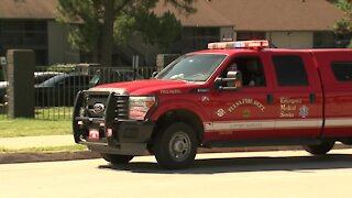 I-244 closed near Southwest Boulevard after man climbs sign