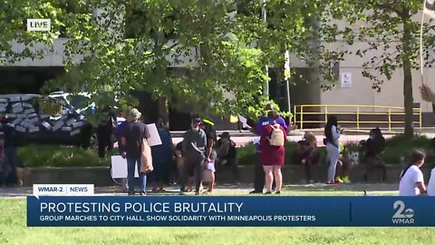 Group marches to city hall showing solidarity with Minneapolis protesters