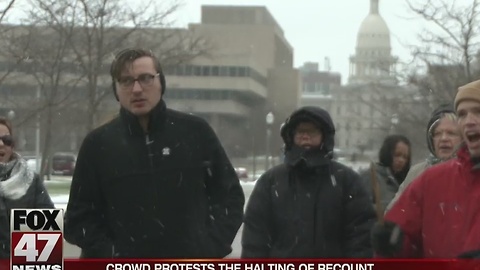 Crowd protests the halting of recount