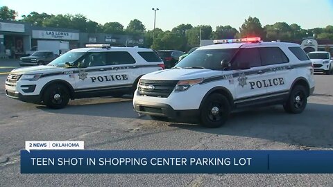 Teen shot in shopping center parking lot