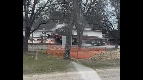 Train Crashes Into Truck Carrying Concrete Beam