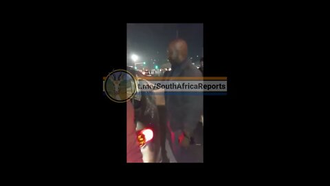 SA Riots ( Policeman caught looting )