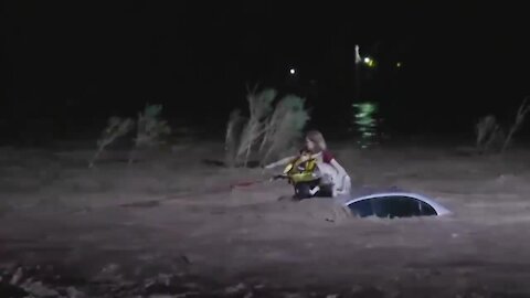 Woman, dog rescued in from flooded wash near Camino de la Tierra and River