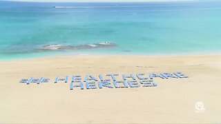 Singer Island resort spells out #HealthcareHeroes with beach chairs