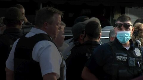 Buffalo Police Officers cover name tags during protest