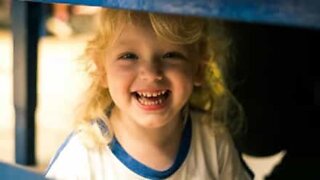 Little girl "helps" mother do the dishes