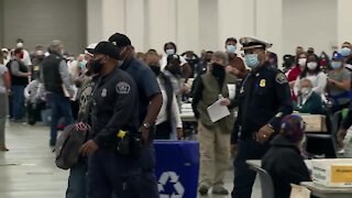 Poll challenger escorted out of TCF Center