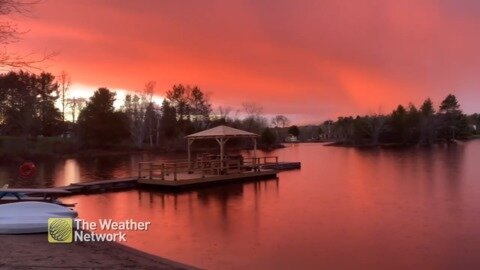 Incredibly vibrant rose gold sunset over the water