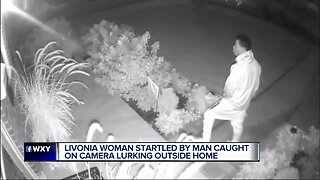 Man caught on surveillance video lurking, looking into windows of home in Livonia