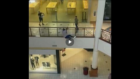 Man leaps from second floor to escape after Apple store theft.