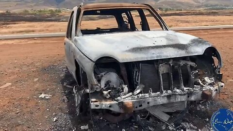 LAHAINA MAUI FIRES MORE EVIDENCE - 2 MILES FROM LAHAINA FIRE A MELTED CAR SURROUNDED BY GRAVEL