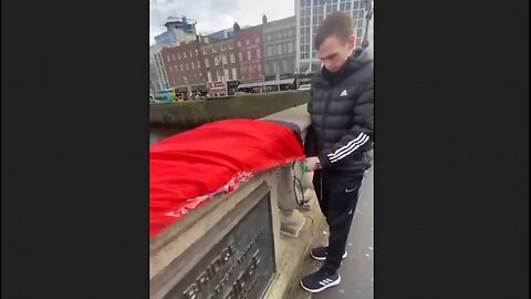 Irish Nationalists remove a Palestinian flag from a bridge in Dublin