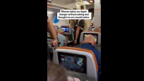 Man goes off after he catches a woman stealing his phone charger on a flight to Miami, Florida.