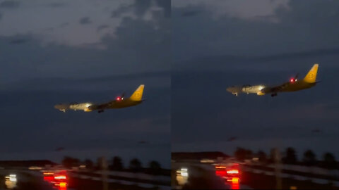 The airport is over the water and the plane landing at night is more beautiful