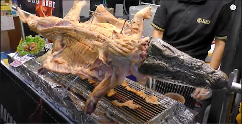 Whole Crocodile Cut and Grilled. Thai Exotic BBQ. Street Food in Phuket, Thailand Thailand