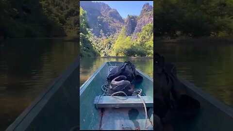 Taking a Boat though a Laos mountain w/ our motorbike!