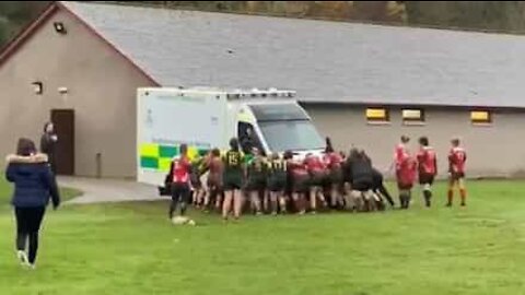 Women's rugby teams join forces to move ambulance